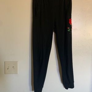 Black joggers with rose